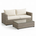 Set divano da giardino 2 posti e tavolino beige in rattan PE con cuscini 136 x 75 x 78 cm
